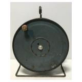 Old blue metal hose shop reel
