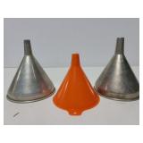Trio of metal and plastic funnels