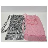 Two vintage waist aprons