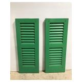 Green painted wood shutter pair