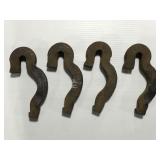 Four heavy cast metal iron? Railroad pieces?