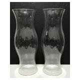 Two large glass candle domes