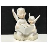 Ceramic caroling angels w/ mesh embellishment