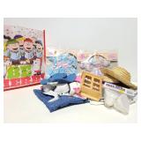 Collection of doll clothing and shoes