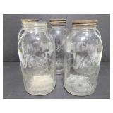 Five large Ball and Kerr mason jars