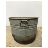 Old galvanized metal wash tub, bottom rounded