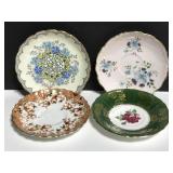 Four assorted fine china saucers