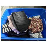 Bin of assorted clothing