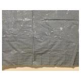 Plastic covered blue checkered fabric tablecloth