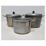 Three old Mirro pots with 2 lids