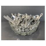 Lot of assorted vintage silverware in glass bowl