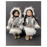 Pair of porcelain Eskimo girl dolls