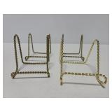 Four metal plate or frame stands