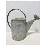 Vintage galvanized steel watering can