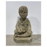 Young boy w/ sailboat cement statue