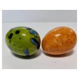 Two ceramic glazed eggs
