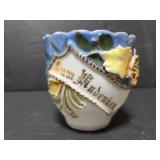 Unmarked raised design teacup