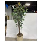 Large artificial tree in wicker basket