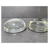 Two magnifying paperweights