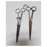 Two pairs of old barber scissors