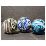 Three signed art glass shooter marbles