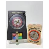 Two travel roulette game wheels