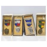 Four marksman medals