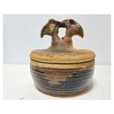 Old vintage pottery pot with lid