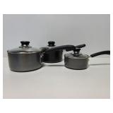 Three pots with lids