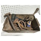 Collection of antique tools and parts in metal bin