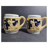 Pair of unmarked vintage embossed mugs