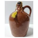 Vintage pottery jug with cork
