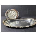 Two marked metal dishes