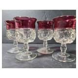 Set of 4 small glass red rim goblets