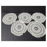 Five vintage round doilies