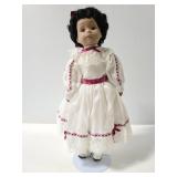 Porcelain doll in lace dress