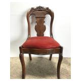 Vintage carved wood chair w/ red upholstered seat