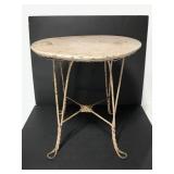Small metal loop leg rusty garden table