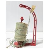 Red cast iron thread holder with thread