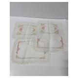 Four embroidered lace edge pieces