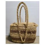 Large lidded basket full of tins