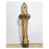 wood and cast iron rack with sticks