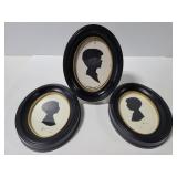 Three vintage oval framed silhouette art