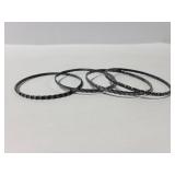 Four small sterling bangle bracelets