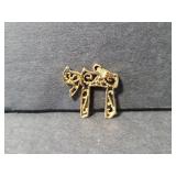 Ornate neclace charm marked 14k
