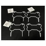 Four small dog bone metal hooks