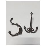 Two cast metal wall hooks