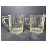 Two glass beer pitchers