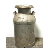 Old large metal milk jug