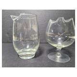 Two glass cups with spouts